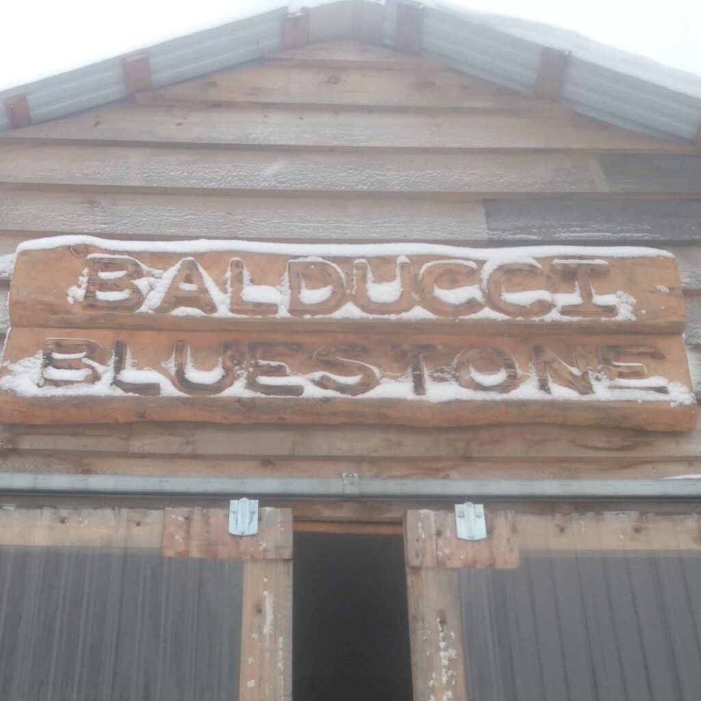 Balducci Bluestone sign with snow